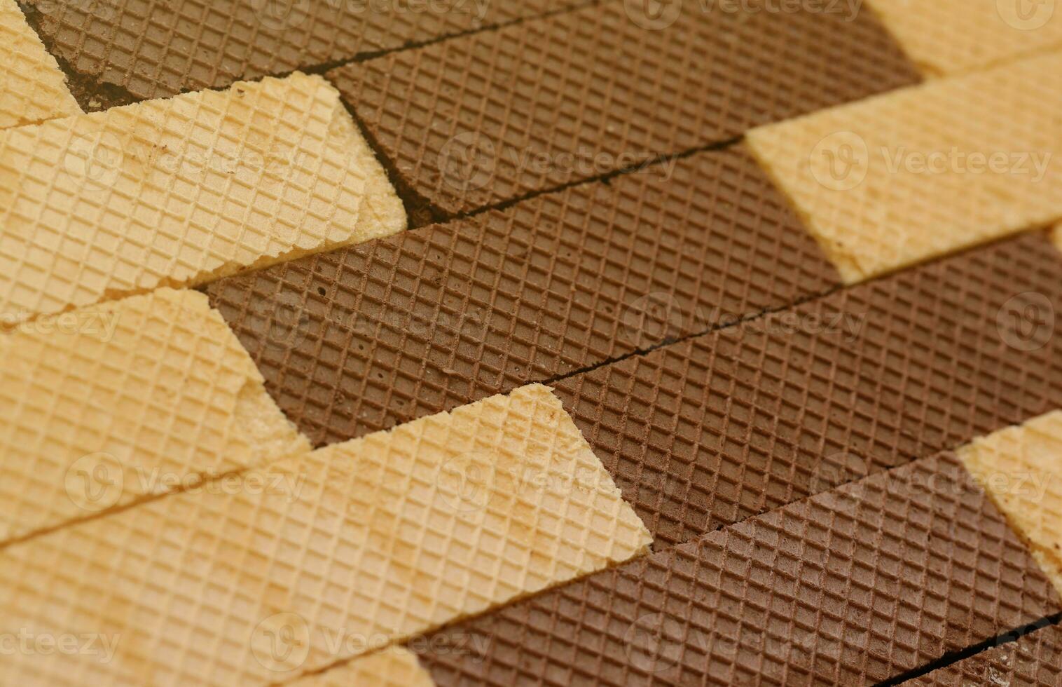 Stacked delicious chocolate wafers in large amount. Two different flavours of classic waffles photo