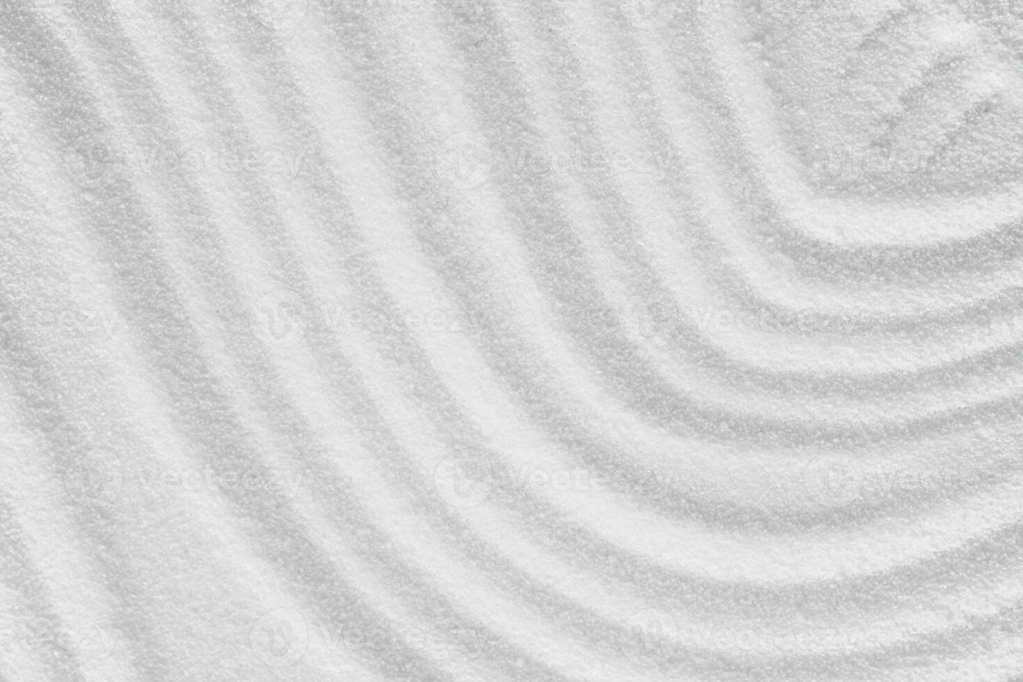 Zen Garden with concentric circless on white sand texture background,Japanese Zen Garden with lines texture, Zen like concept,Top view Sand surface with copy space for Spa, Cosmetic background photo