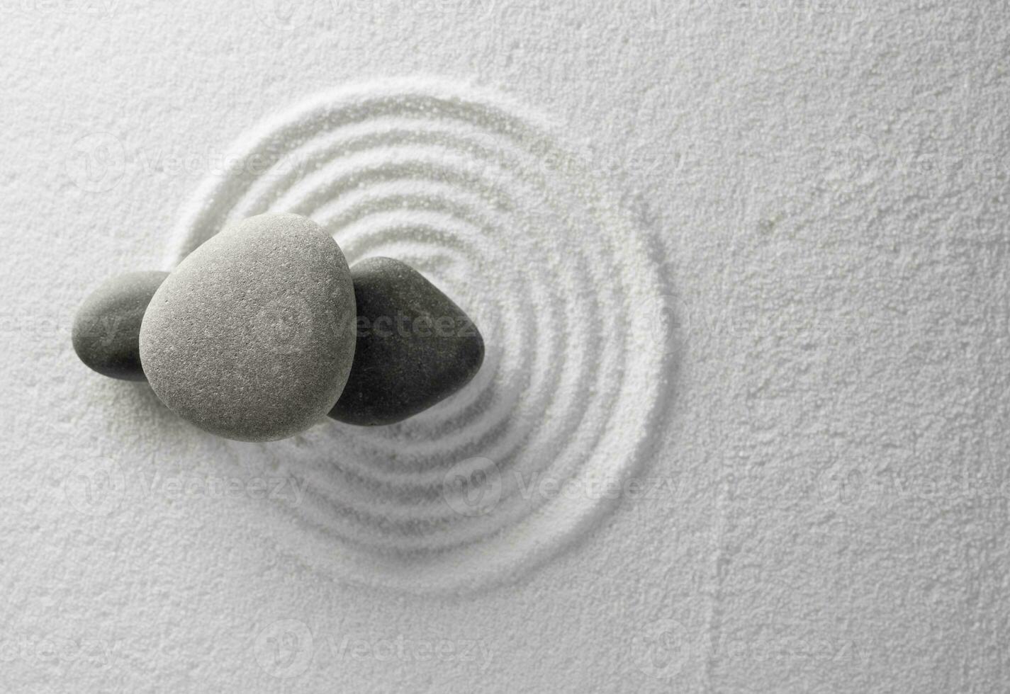 Zen Garden with Grey stone on White Sand Circles Pattern in Japanese stye, Harmony,Meditation,Feng Shui ,Zen like concept photo