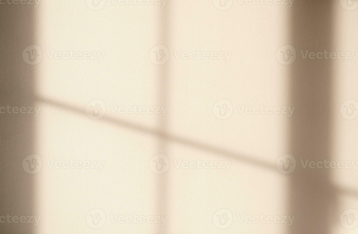 Beige wall background,Concrete texture with light,Shadow  reflect from window,Empty Cement room transparent Sunlight on plaster paint,Backdrop for Autumn, fall mockup Product Design presentation photo