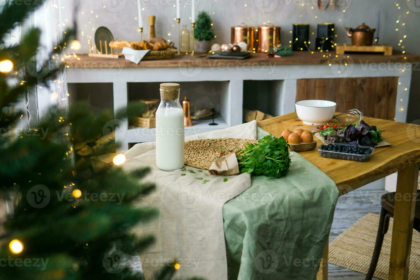 Home New Year's interior. Christmas tree with gifts, decorated with garlands in the kitchen. Cozy atmosphere of a home holiday, loft design of the room, Scandinavian style. photo