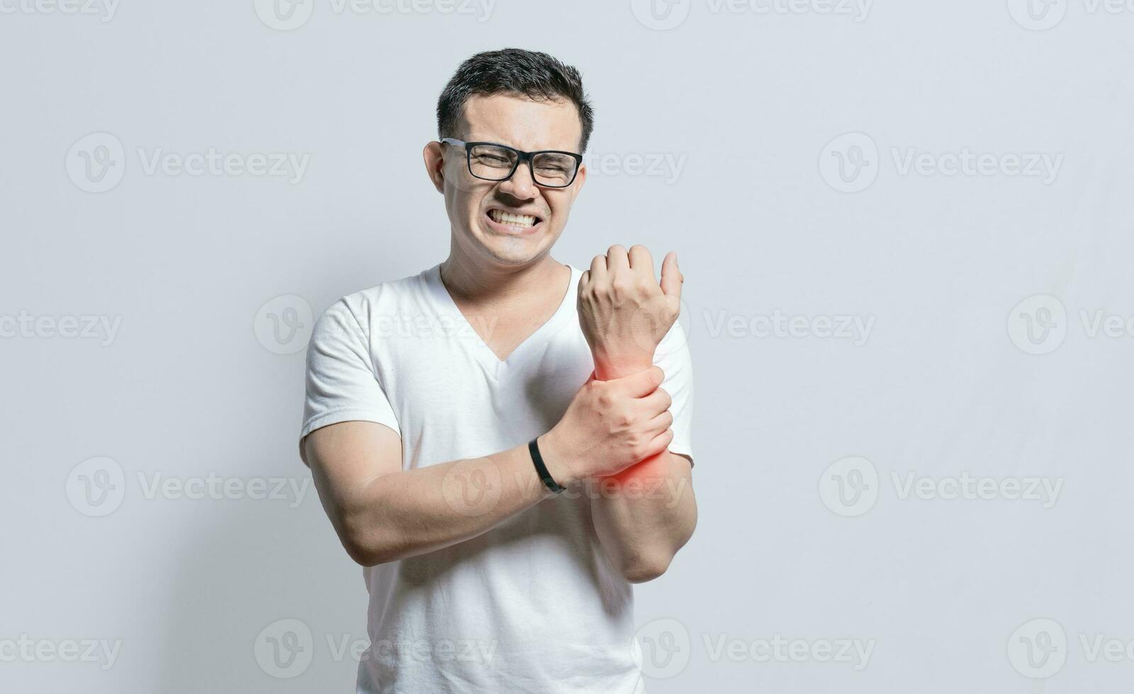 Handsome man with wrist pain isolated, Arthritis and wrist pain concept, People with wrist pain on isolated background, Arthritis man rubbing, Person with wrist pain photo