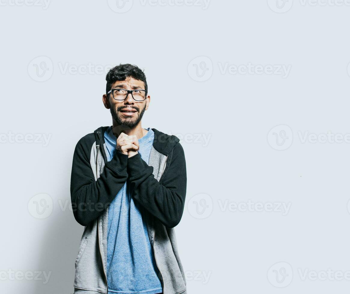 Person pleading with hands together isolated. distressed man asking for a favor, People putting hands together asking please, Hopeful person asking for help or apologizing photo