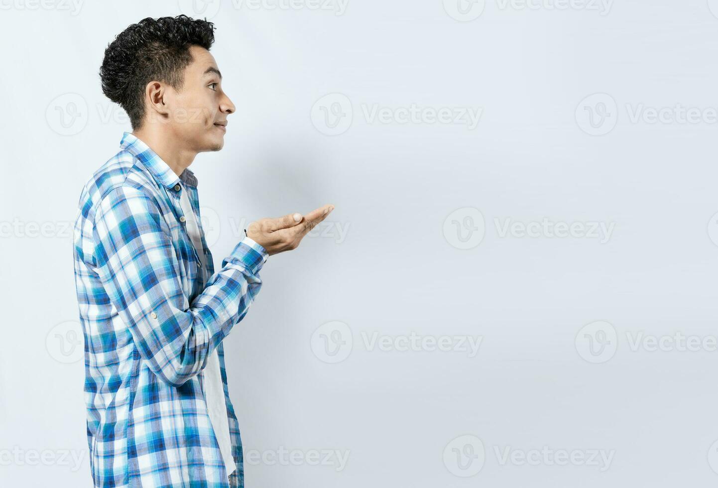 Man recommending an advertisement with the palm of his hands. Guy recommending an ad space isolated, Smiling person recommending a product with his hands photo