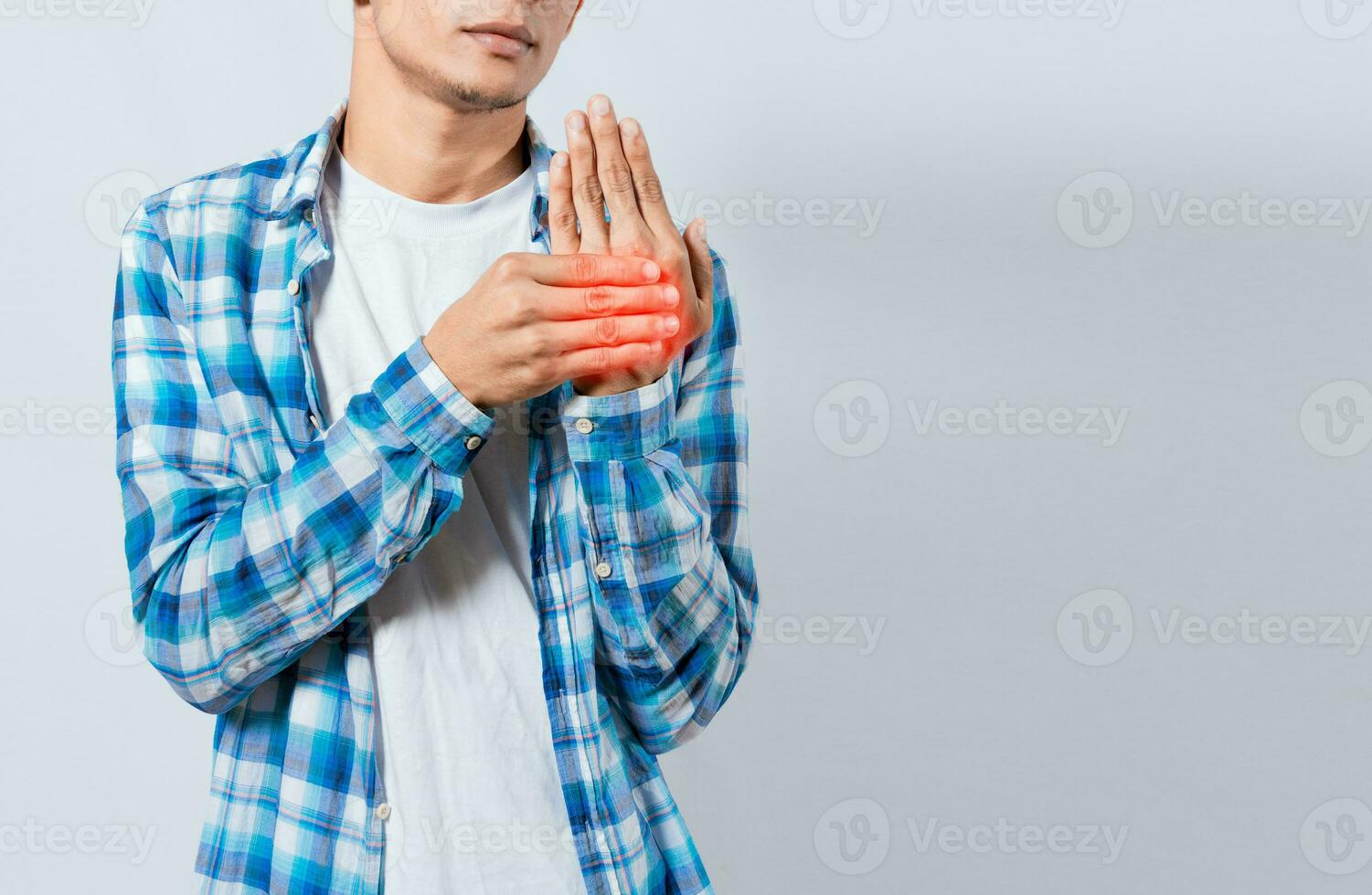 People with arthritis and hand pain, Young suffering person with pain in hand joints. Man with pain in hands with copy space. Man with arthritis rubbing his hands photo