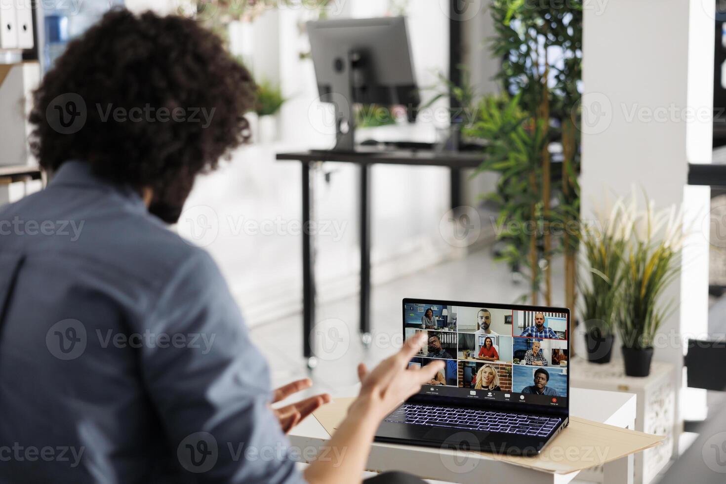 Executive discussing start up project strategy with coworkers during videocall on laptop. Businessman collaborating with remote team through virtual meeting on portable computer screen photo