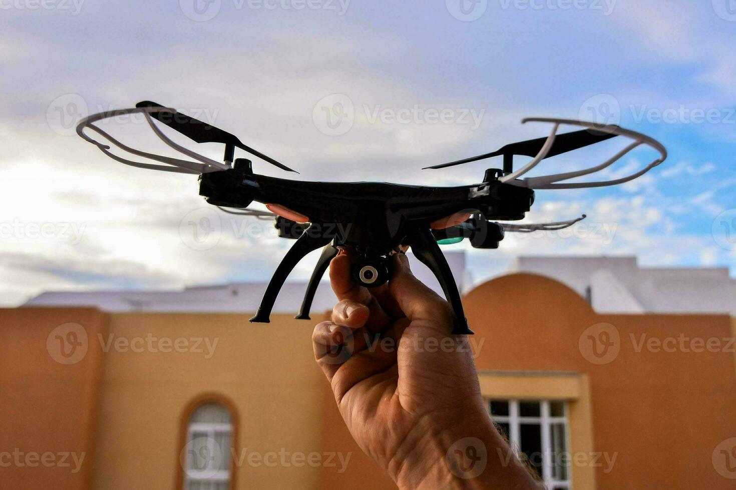 Hand holding a drone photo