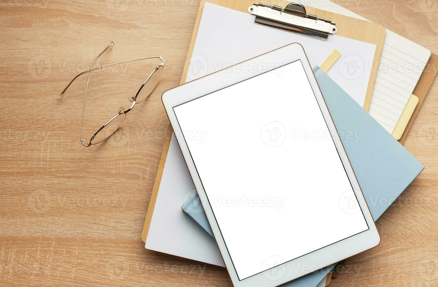 Tablet pc  and notebooks  on the office desk photo