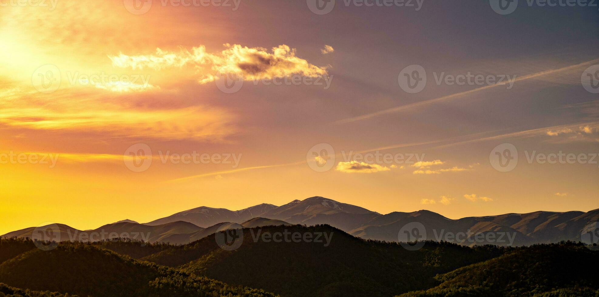 Mountains on sunset background photo