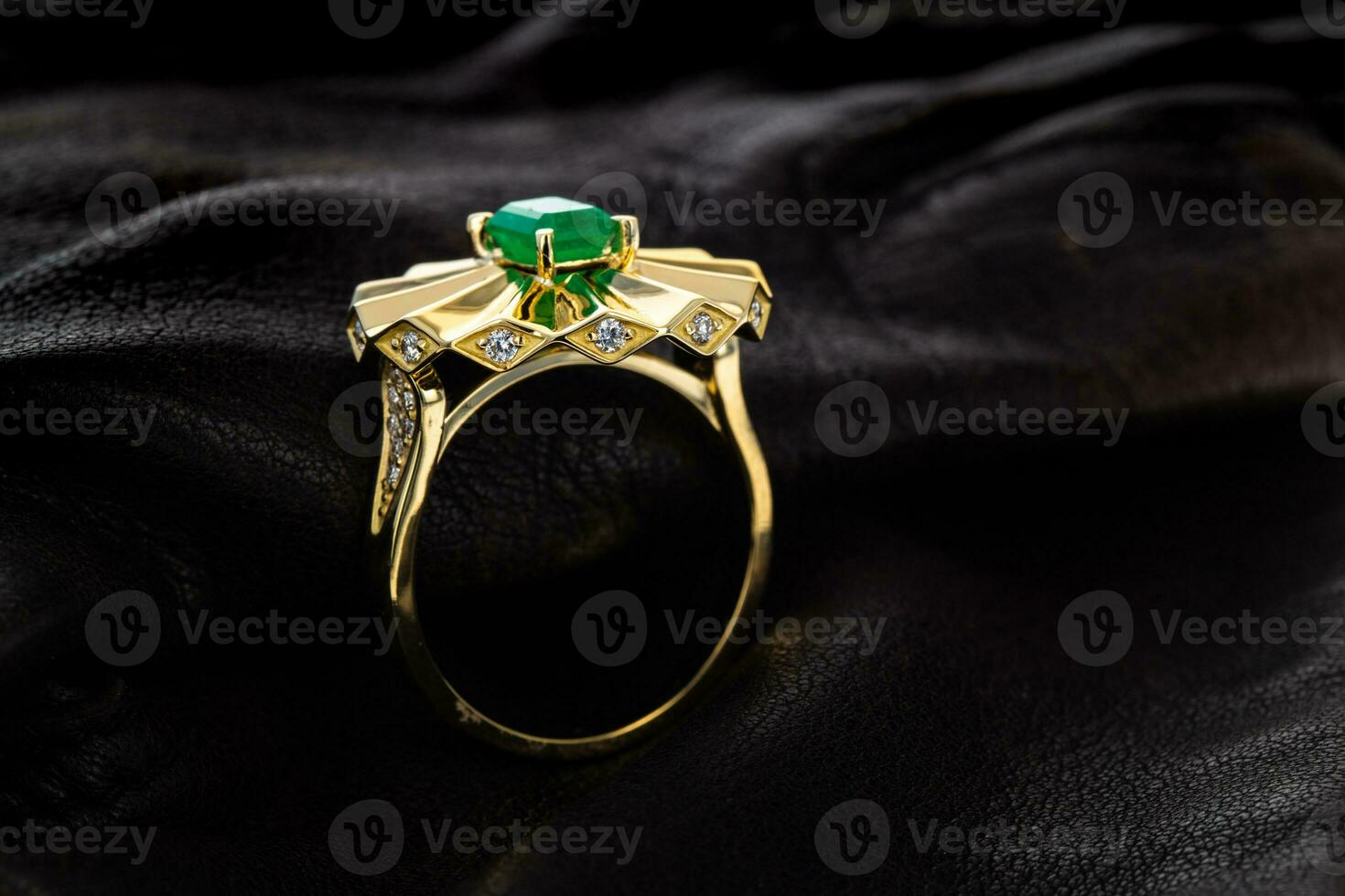 Gold emerald ring with diamonds photo