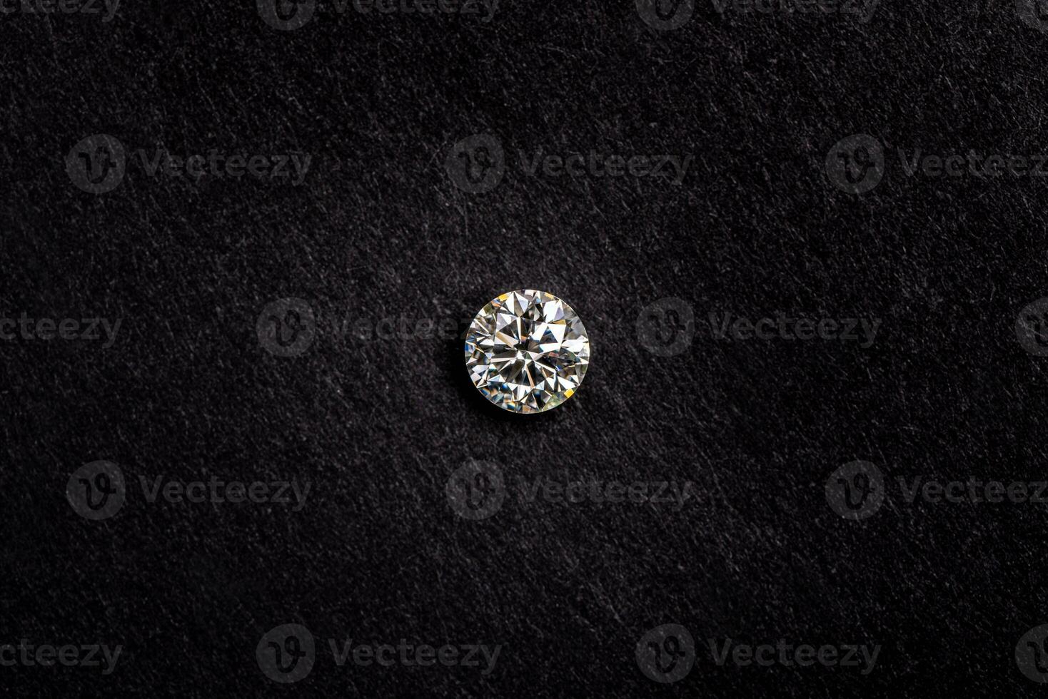 Diamond on black background photo