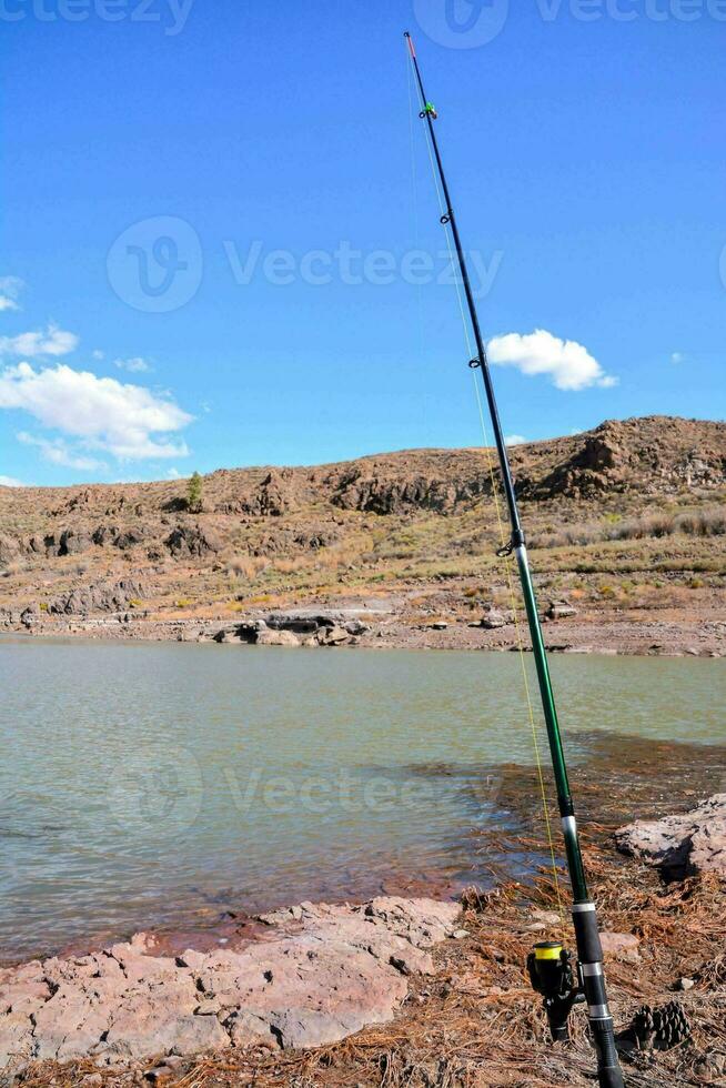 Fishing on the shore photo