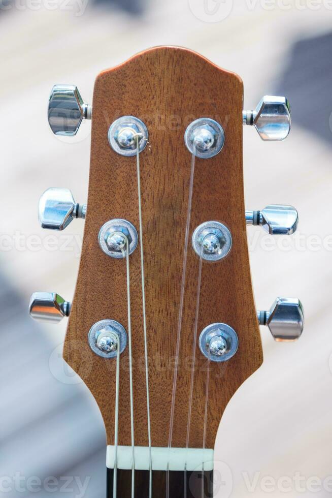 detalle de guitarra con superficial foto