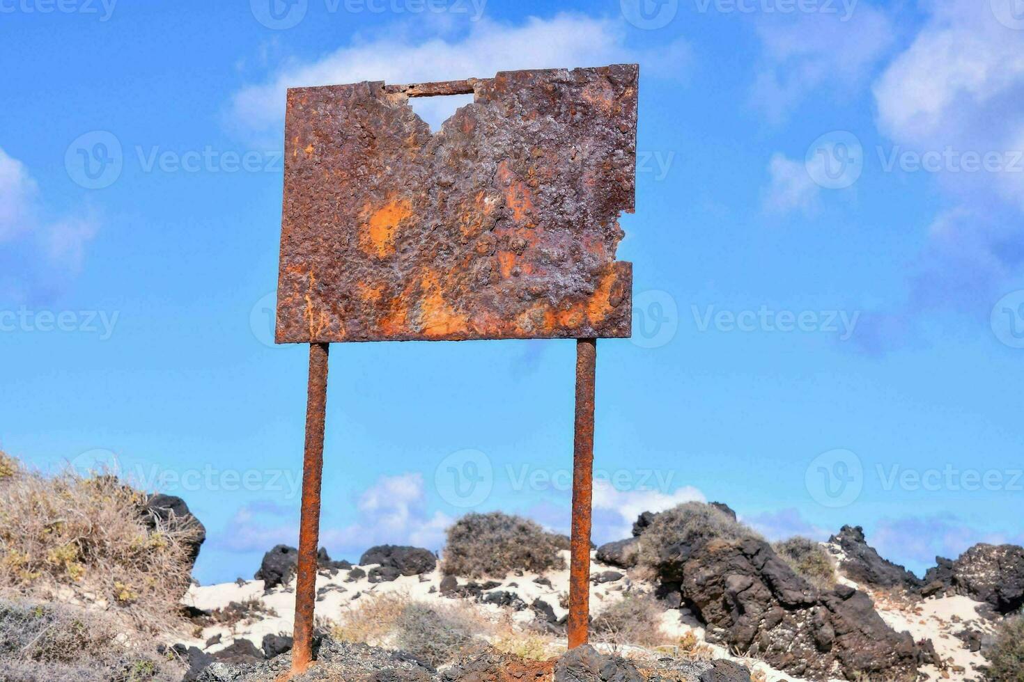 A rusted sign photo