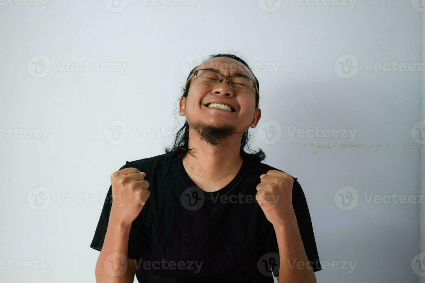 Adult Asian man wearing black t-shirt photo