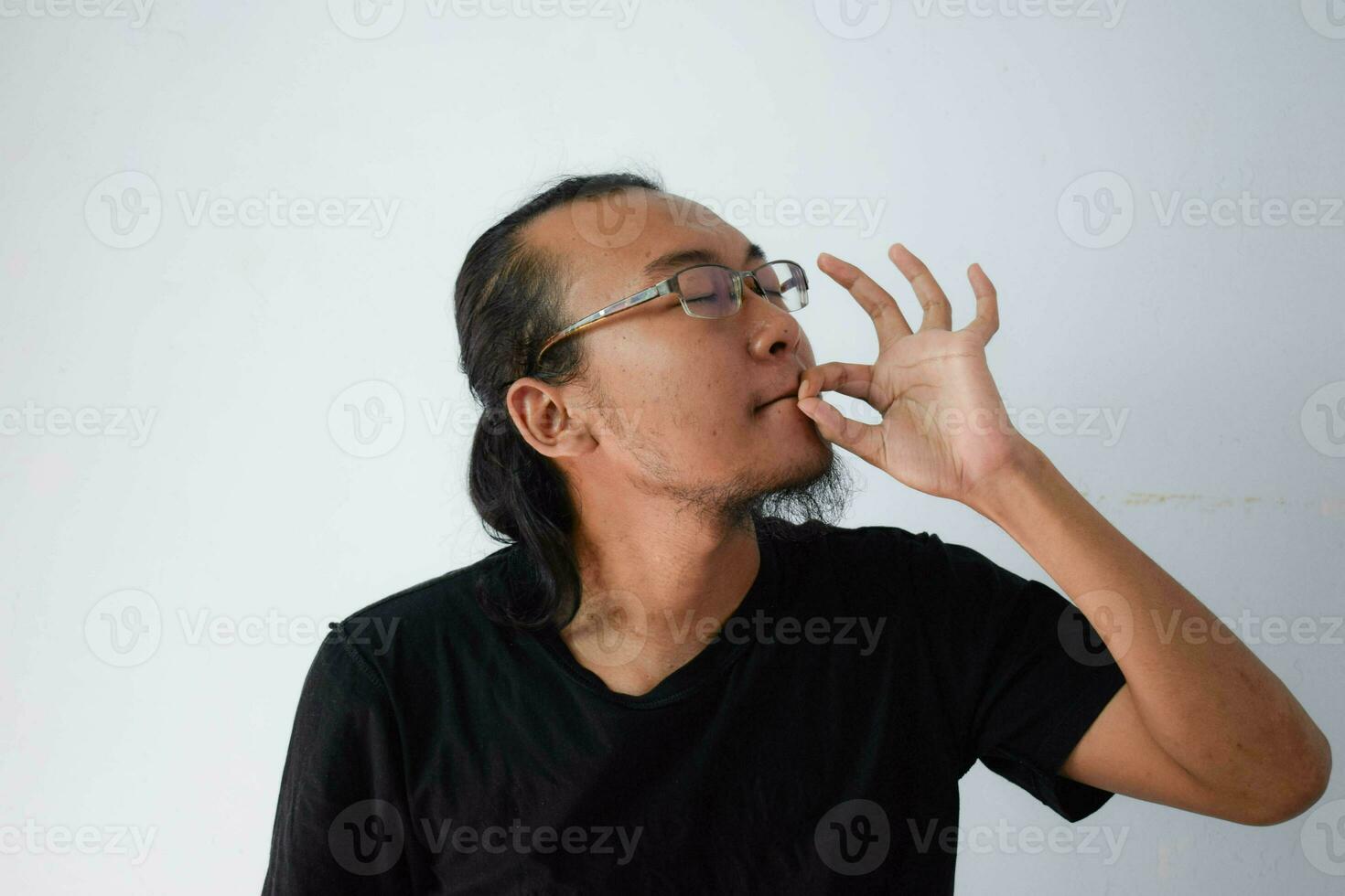 Adult Asian man wearing black t-shirt photo
