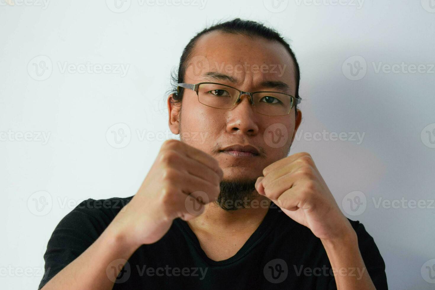 Adult Asian man wearing black t-shirt photo