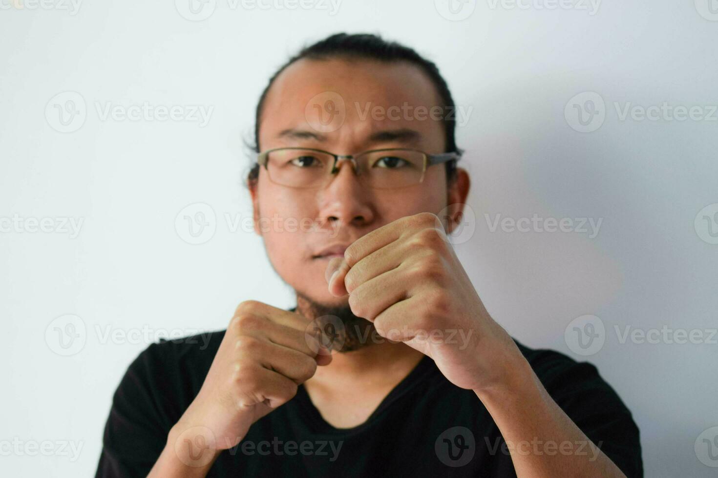 Adult Asian man wearing black t-shirt photo