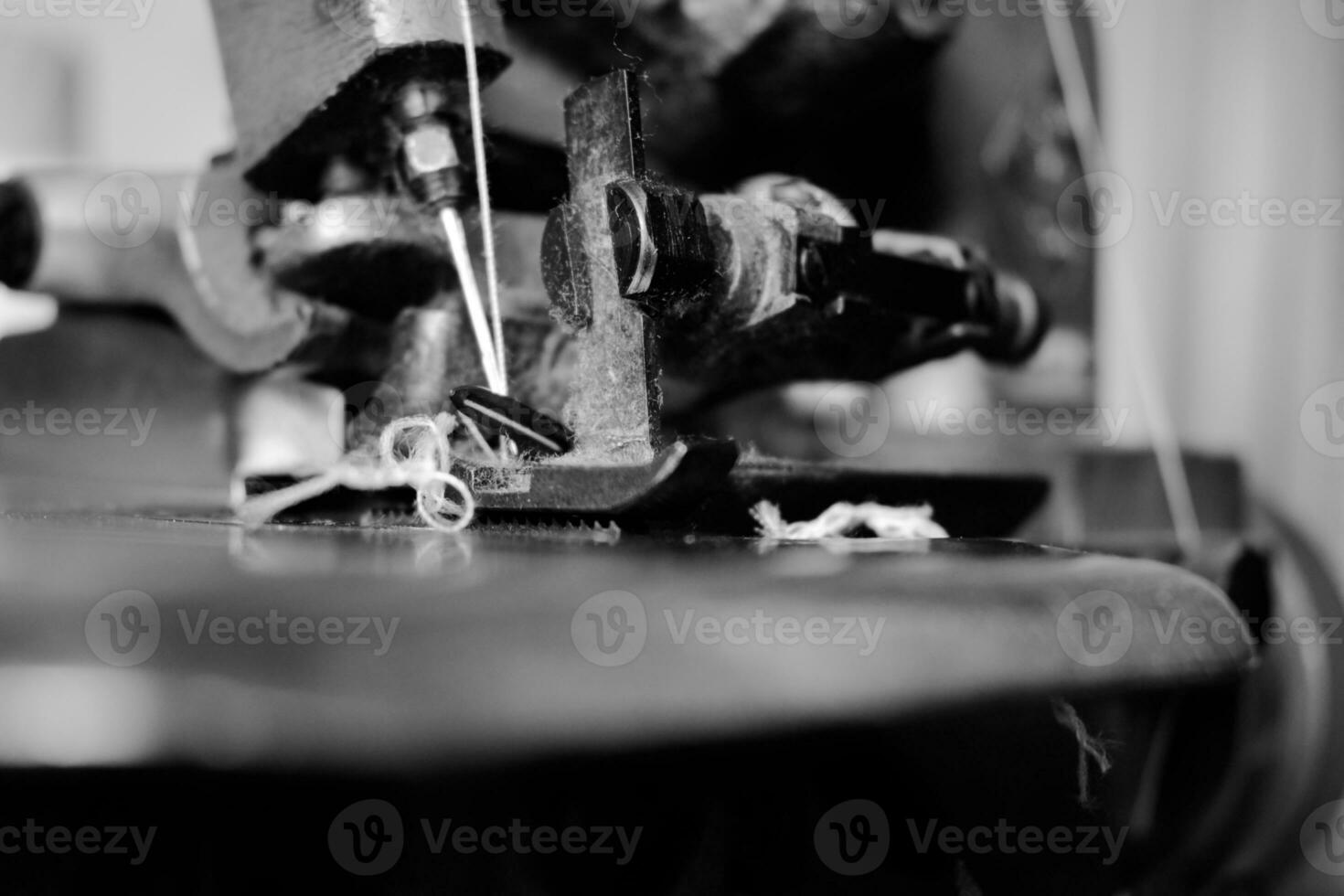 Vintage Black and White Close up Serger or Overlock Machine with threads, vintage black and white concept photo