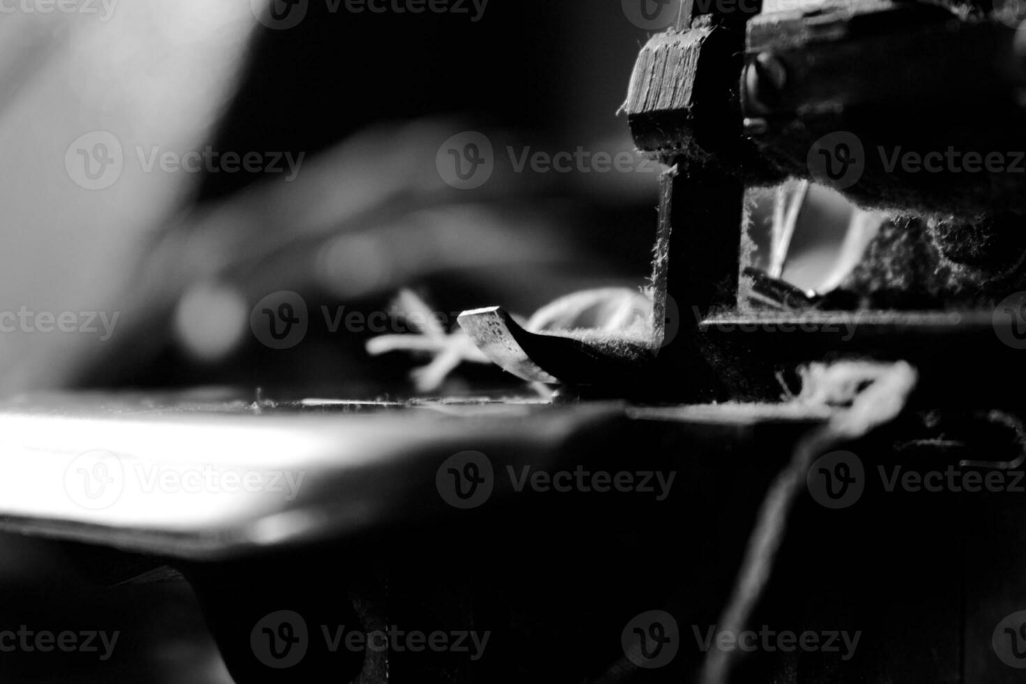 Vintage Black and White Close up Serger or Overlock Machine with threads, vintage black and white concept photo