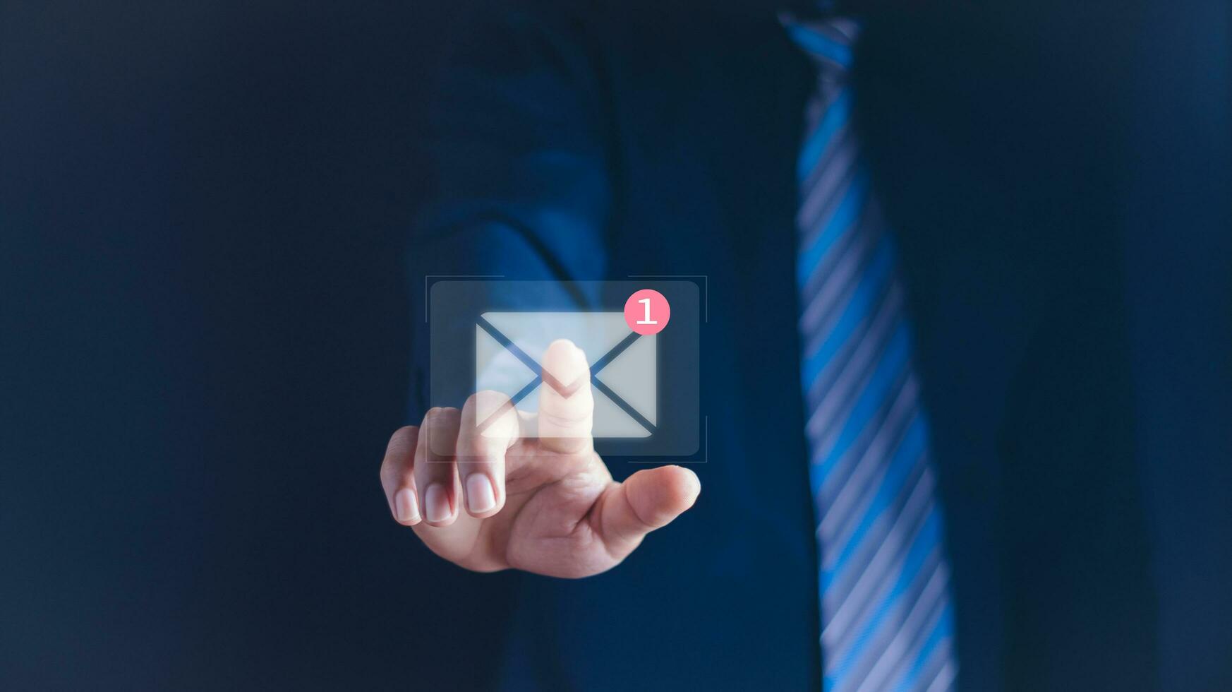 Businessman holding tablet and touching with virtual white newsletter for electronic mail or E-mail with notification alert concept. photo