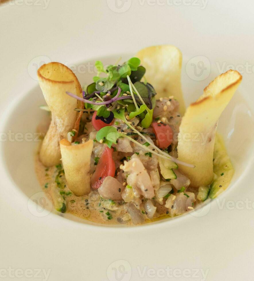 Sea bass tartare with gourmet toast in a European restaurant photo