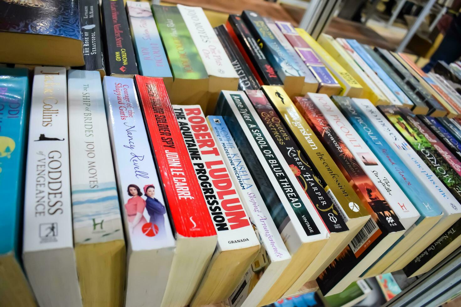 New Delhi, India, September 09 2023 - Variety of Books on shelf inside a book-stall at Delhi International Book Fair, Selection of books on display in Annual Book Fair. photo