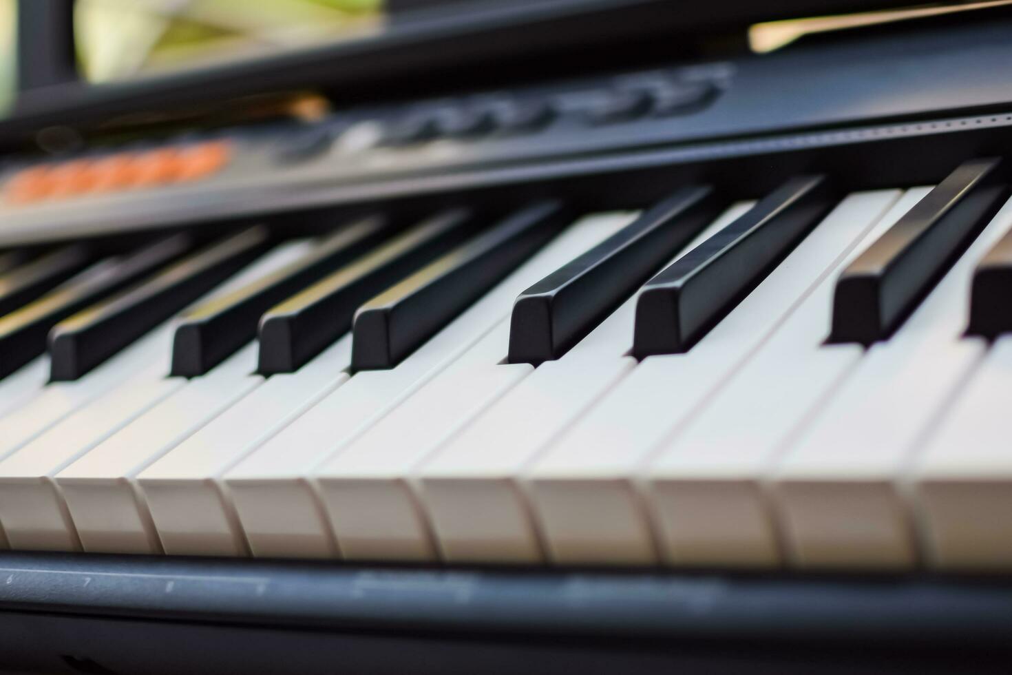 Close-up of piano keys. Piano black and white keys and Piano keyboard musical instrument placed at the home balcony during sunny day. photo