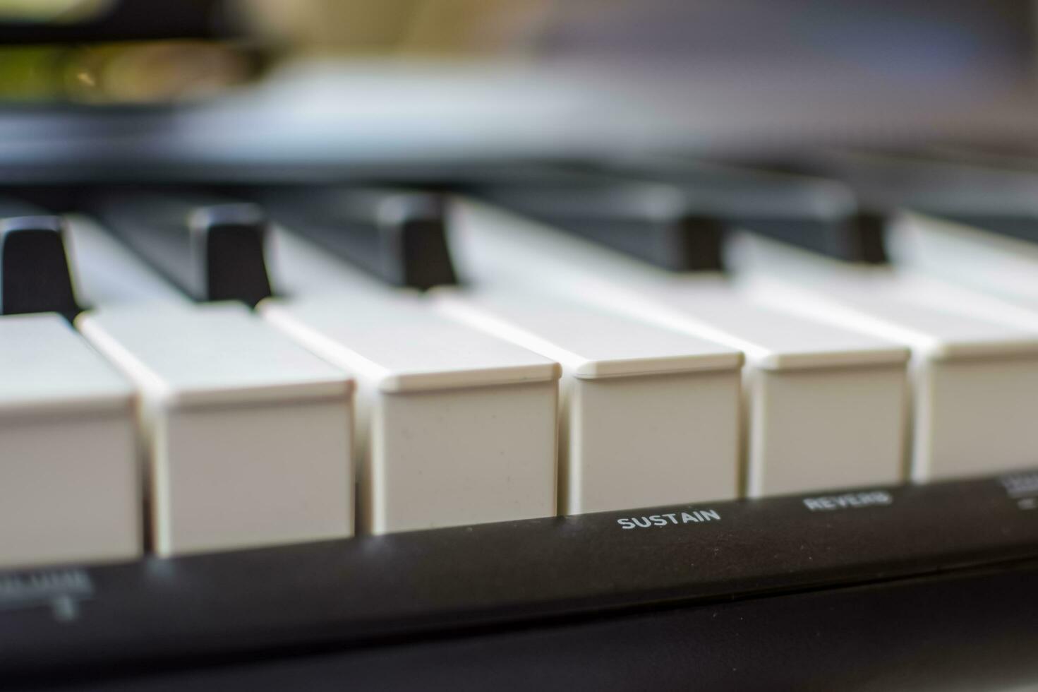 Close-up of piano keys. Piano black and white keys and Piano keyboard musical instrument placed at the home balcony during sunny day. photo