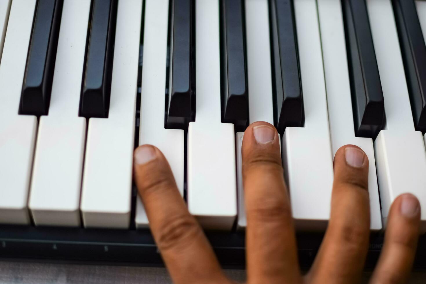 Close-up of piano keys. Piano black and white keys and Piano keyboard musical instrument placed at the home balcony during sunny day. photo