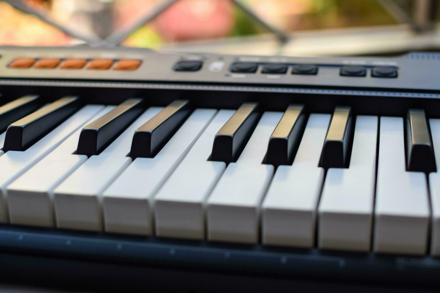 Close-up of piano keys. Piano black and white keys and Piano keyboard musical instrument placed at the home balcony during sunny day. photo