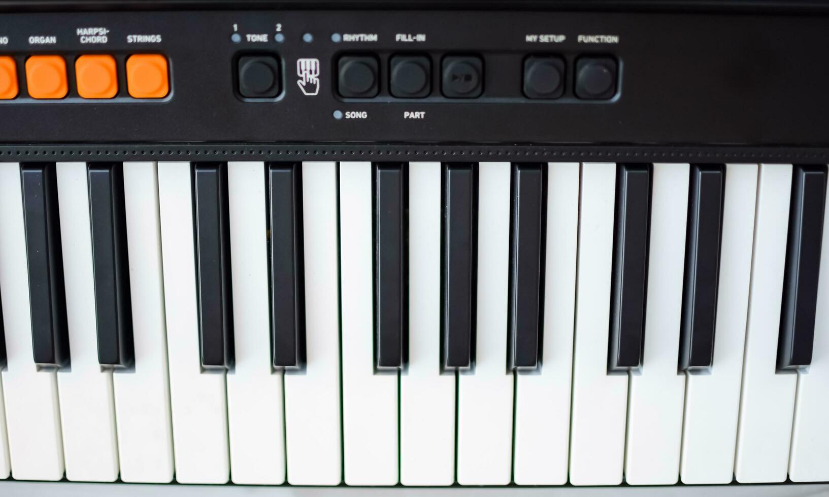 Close-up of piano keys. Piano black and white keys and Piano keyboard musical instrument placed at the home balcony during sunny day. photo