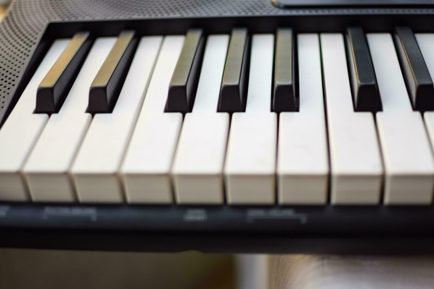 Close-up of piano keys. Piano black and white keys and Piano keyboard musical instrument placed at the home balcony during sunny day. photo