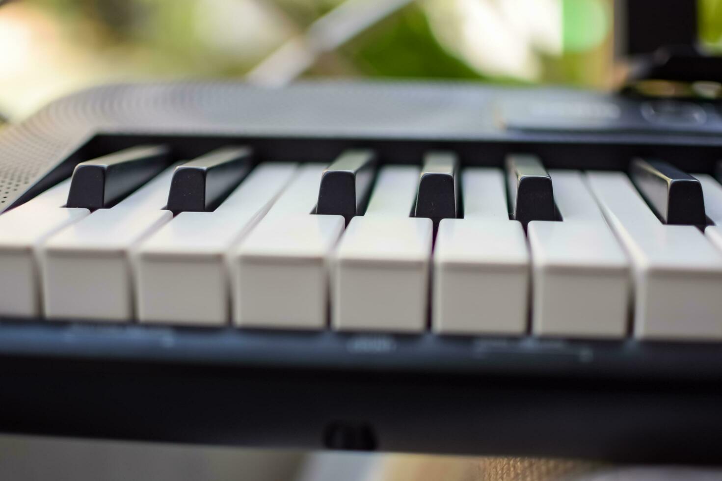 Close-up of piano keys. Piano black and white keys and Piano keyboard musical instrument placed at the home balcony during sunny day. photo