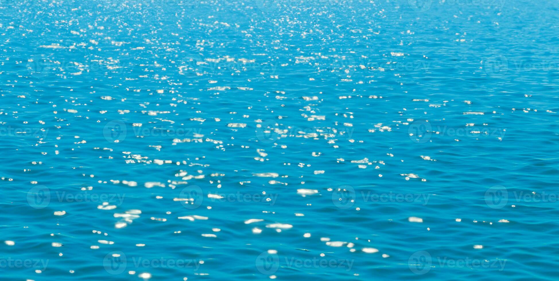 Beautiful blurred natural blue background with highlights on the water. The concept of summer holidays at sea. AI Generative photo