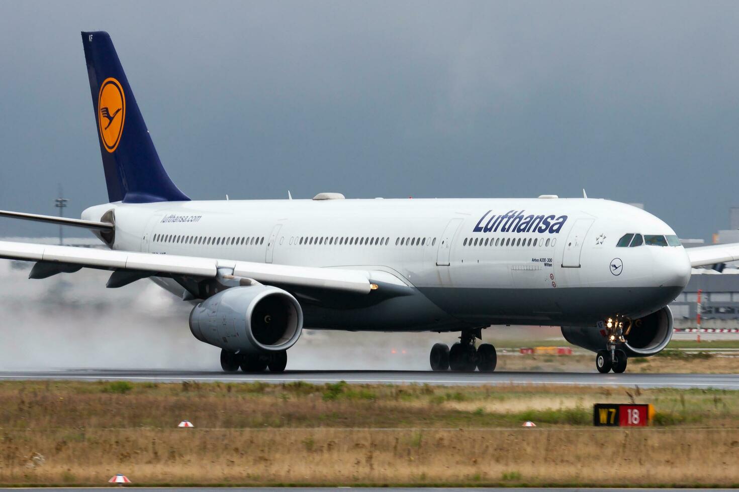 Lufthansa passenger plane at airport. Schedule flight travel. Aviation and aircraft. Air transport. Global international transportation. Fly and flying. photo