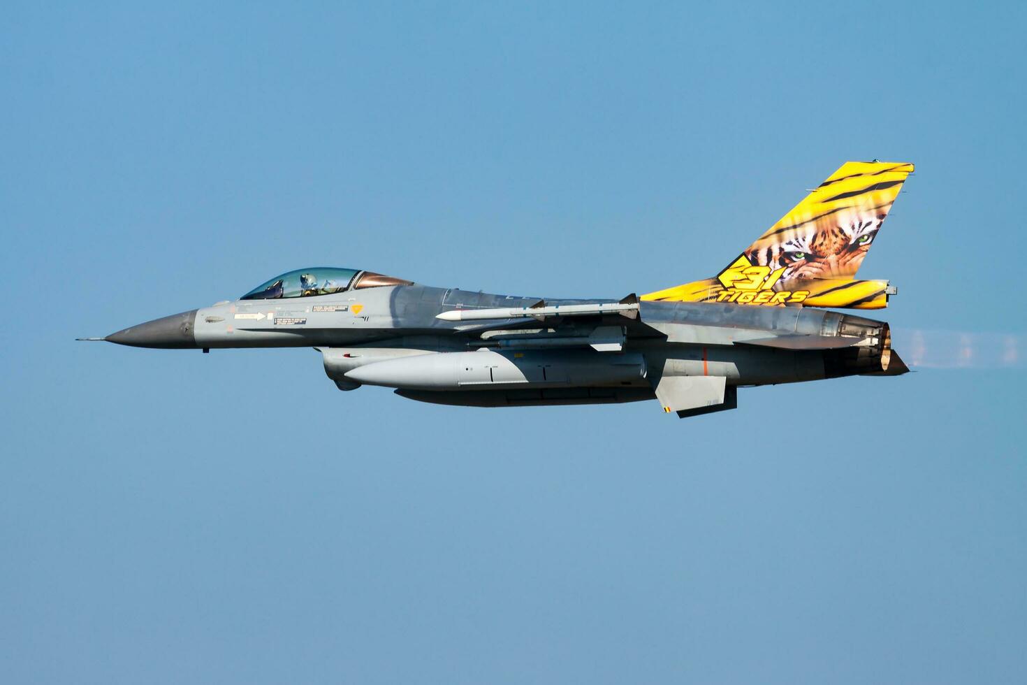 Military fighter jet plane at air base. Air force flight operation. Aviation and aircraft. Air defense. Belgian Air Force F-16. photo