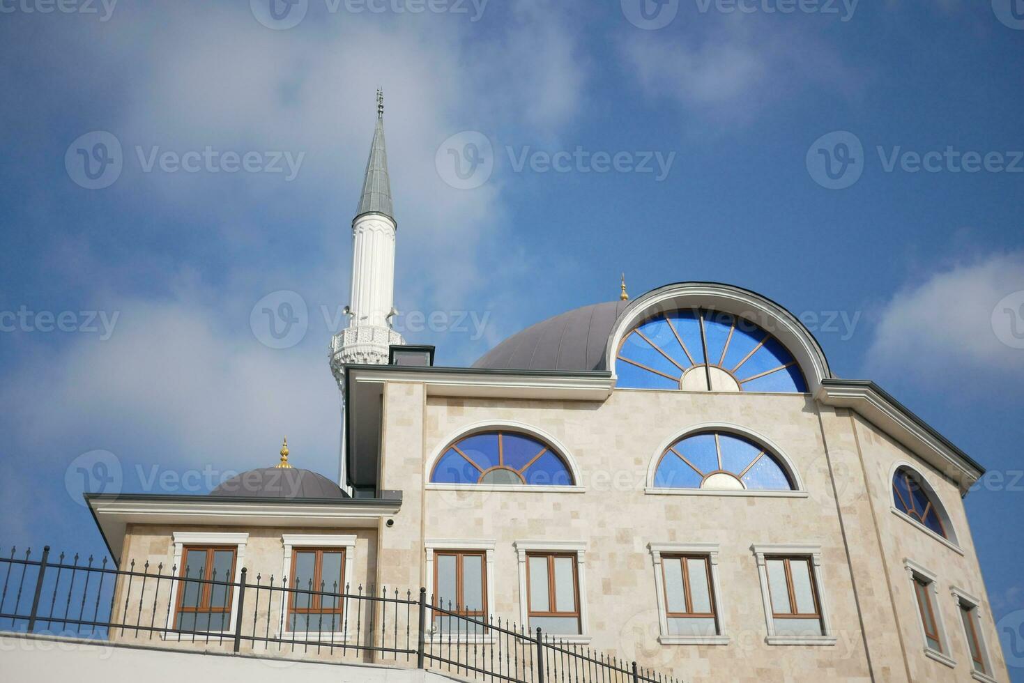 the dome of a mosque against blue sky in istanbul photo