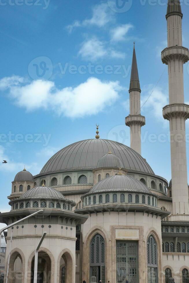 the dome of a mosque against blue sky in istanbul photo