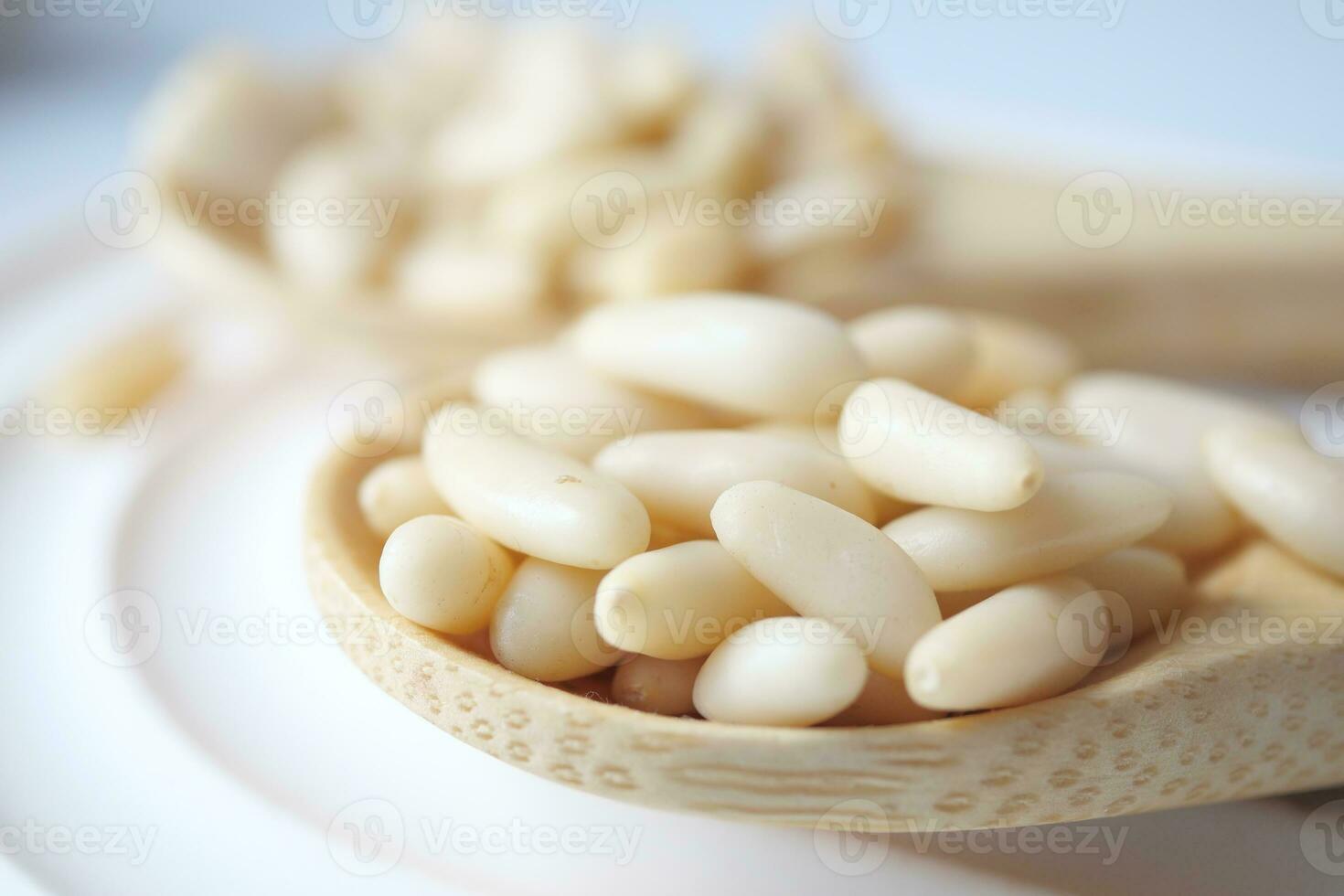 Healthy pine nuts isolated on white background. photo