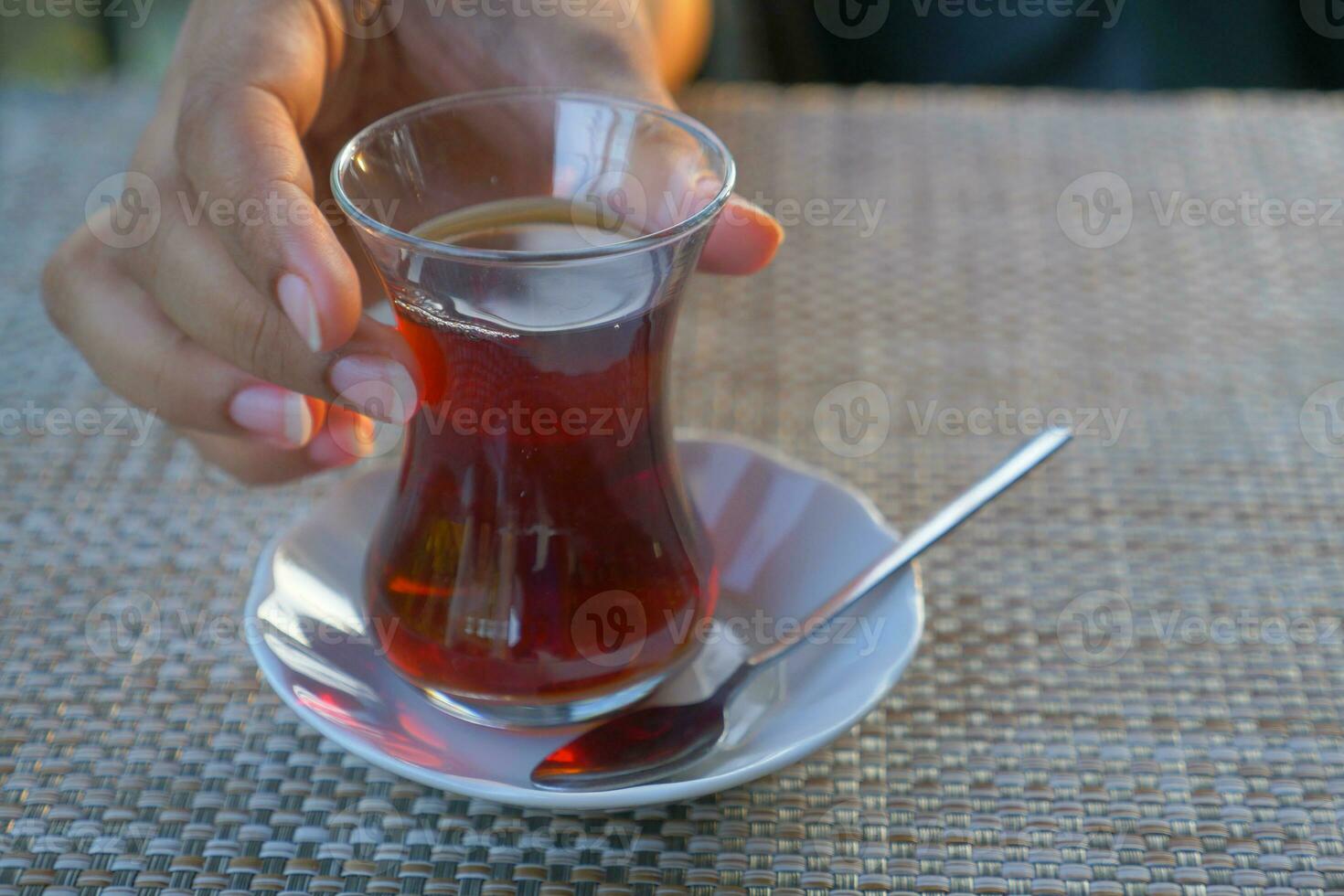 Traditional turkish tea on white table . photo