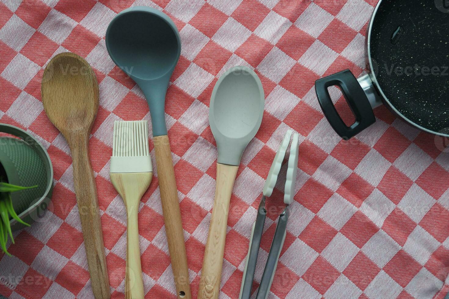 wooden cutlery fork and spoon on a chopping board on table photo