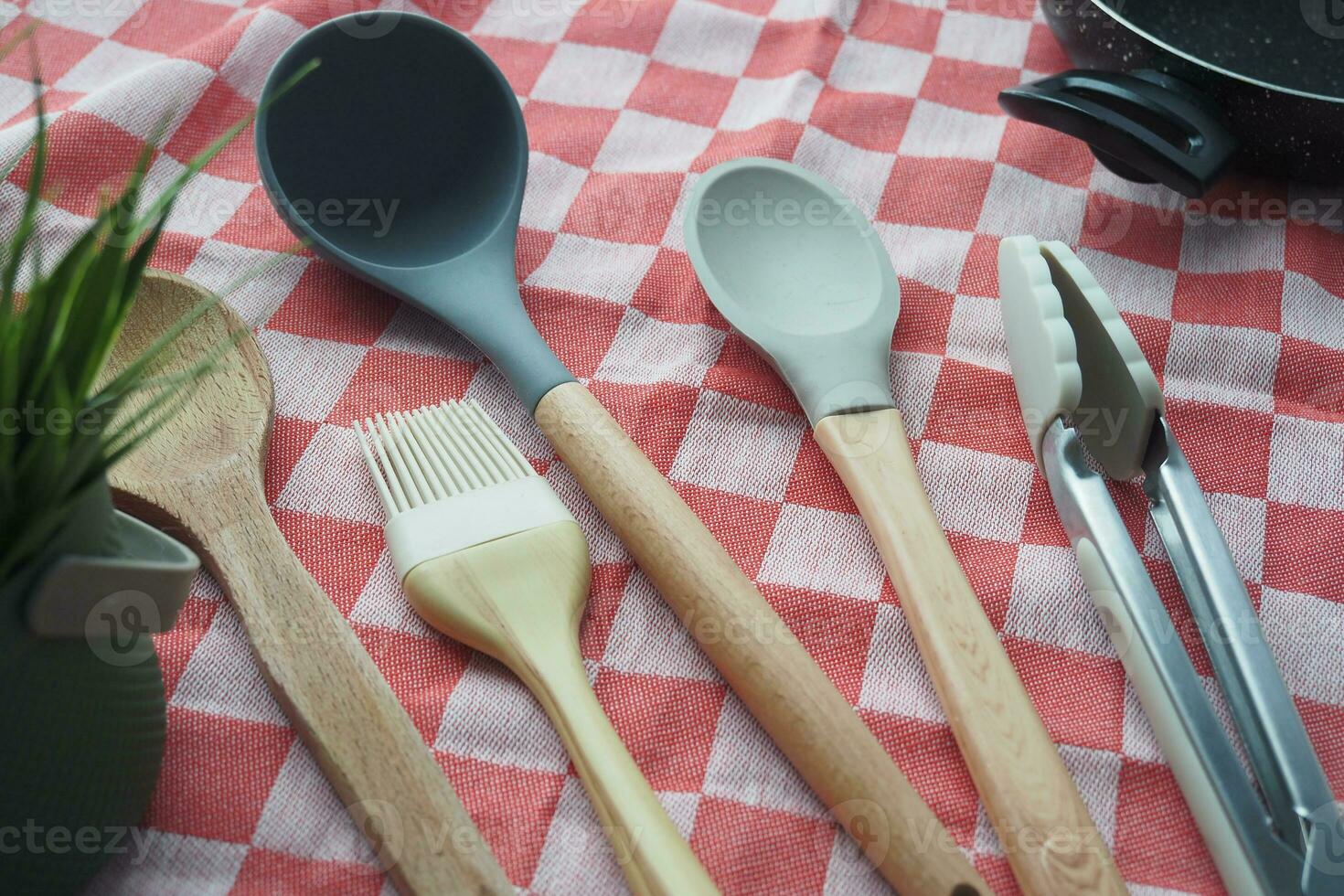 wooden cutlery fork and spoon on a chopping board on table photo