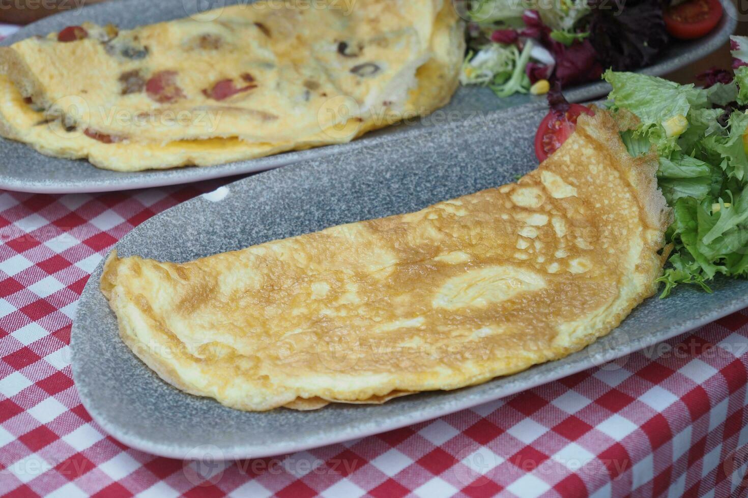 Plain Egg Omelette on breakfast table photo