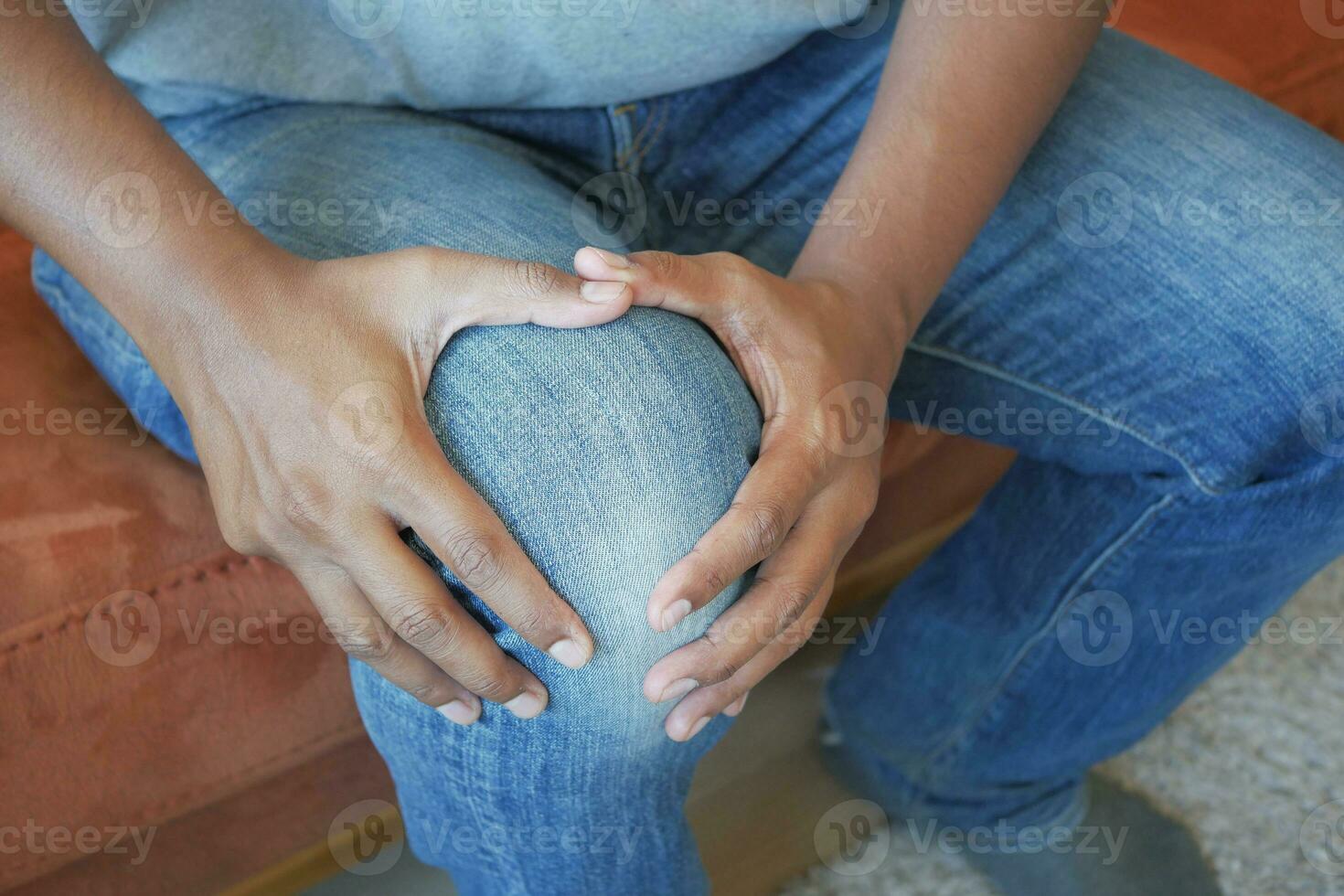 Close up on man suffering knee joint pain photo