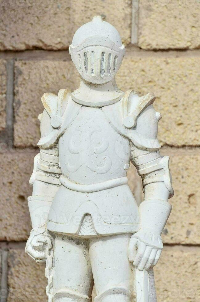 a statue of a knight with a sword photo