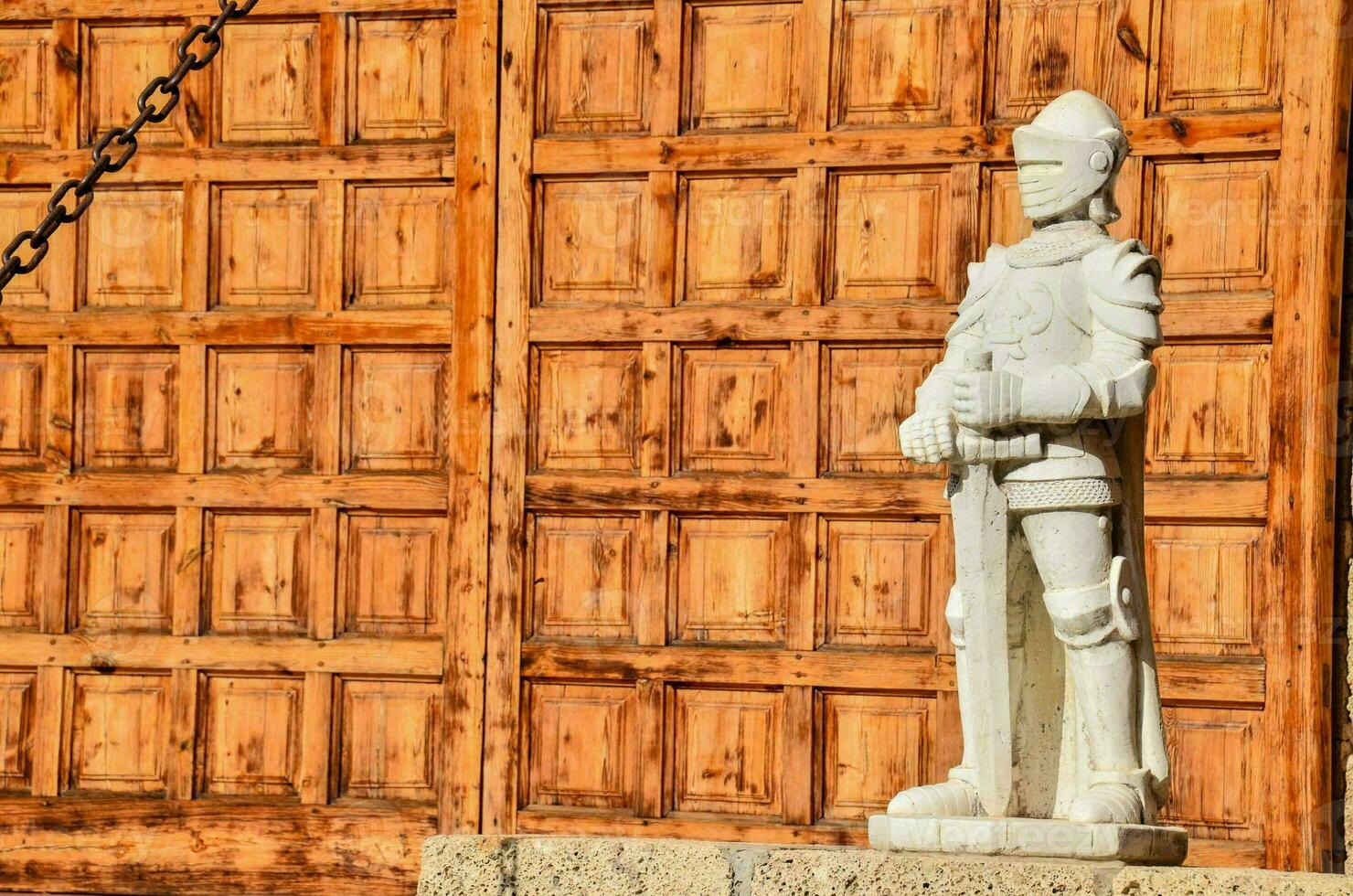 a statue of a knight with a sword photo