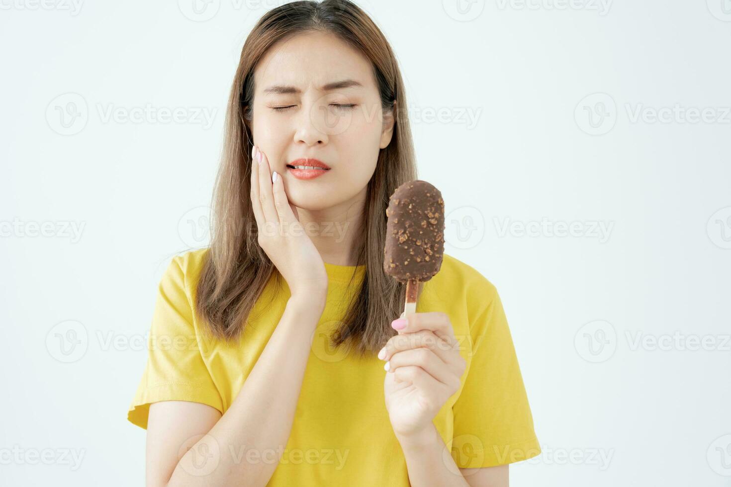 Asian woman feel sensitive teeth after eating ice cream, female suffer tooth, decay problems, dental care, tooth extraction, decay problem, bad breath, Gingival Recession, Oral Hygiene instruction photo