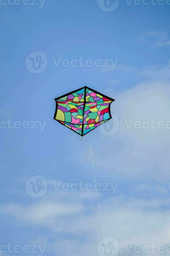 A kite raised in the sky photo