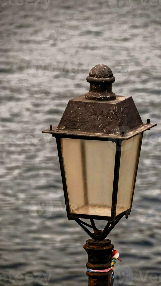 Lamp post on the coast photo